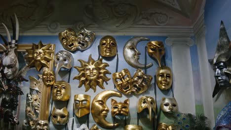 Celestial-themed-masks-at-Ca'-Macana,-Venice-Italy