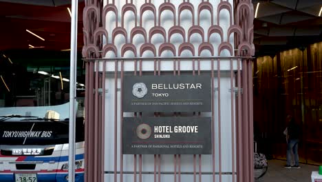 Signs-indicating-the-locations-of-Bellustar-and-Hotel-Groove-Shinjuku-accommodations-in-Tokyo,-Japan