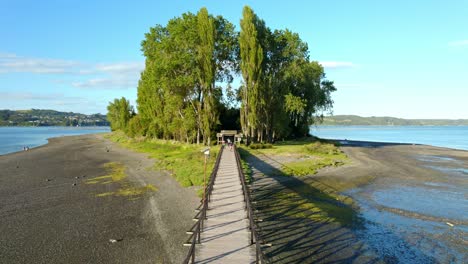 Establishing-descending-on-the-bridge-to-Aucar-Island,-island-of-the-sailing-souls-in-Quemchi,-Chiloé,-Chile