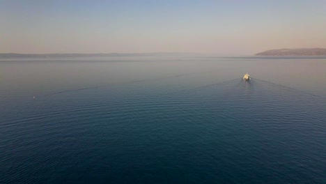 Aerial-Drone-Footage-Of-Motorboat-Cruising-On-The-Sea-In-Croatia