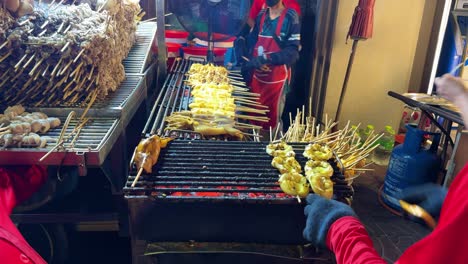 Seafood-on-the-grill-street-food-preparation-in-Bangkok-Chinatown-by-chef