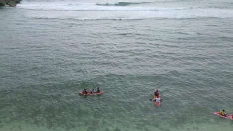 Drone-shot-of-peoples-kayak-on-the-beach