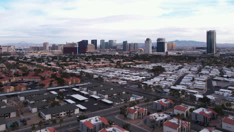 Las-Vegas-Cityscape-Skyline,-Drone-Shot-of-Strip-Casinos-From-West-Residential-Neighborhood