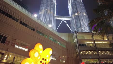 Nighttime-view-of-the-Petronas-Twin-Towers,-an-iconic-symbol-of-Malaysia's-prosperity-and-the-country's-booming-oil-based-economy