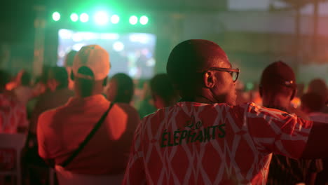 Ivorian-Football-Fan-Wearing-Elephants-Jersey-In-A-Fan-Zone,-Africa-Cup-of-Nations-2023,-Abidjan