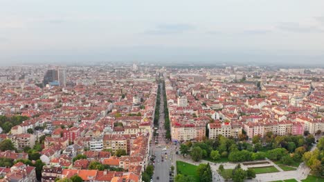 Vitosha-boulevard,-famous-pedestrian-street-in-Sofia,-Bulgaria,-aerial-skyline
