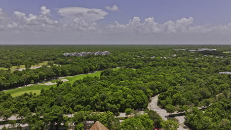 Akumal-Mexico-Aerial-v11-drone-flyover-Riviera-Maya-Golf-Course-capturing-beautiful-landscape-views-of-lush-Mayan-jungle-and-well-designed-fairways-and-bunkers---Shot-with-Mavic-3-Pro-Cine---July-2023