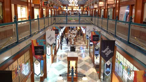 The-interior-of-Brisbane-arcade-with-shoppers-shopping-at-designer-boutiques-at-fashion-laneway,-Queen-street-mall,-central-business-district,-static-shot
