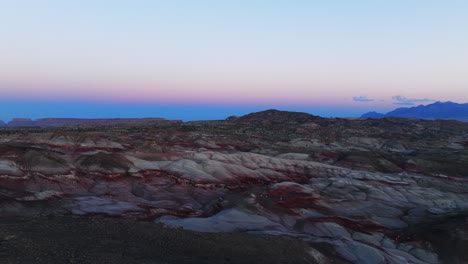 Flying-over-Bentonite-Hills,-Utah-in-USA