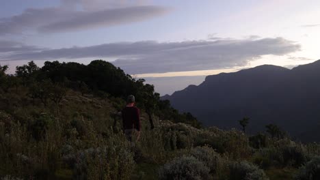 A-camper-looks-out-over-mount-moroto-during-sunrise-in-Uganda-East-Africa