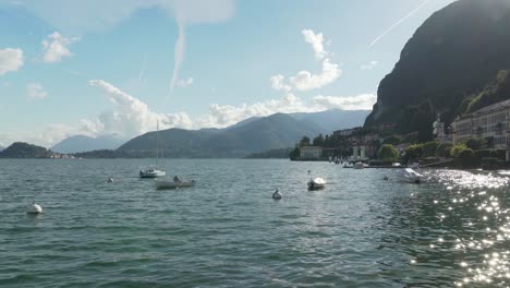 Pescador-Pesca-Peces-En-El-Lago-De-Como,-Cerca-De-La-Ciudad-De-Menaggio.