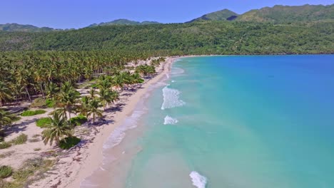 Empty-coastline-with-white-sand-beach,-turquoise-water,-drone-in-the-Caribbean