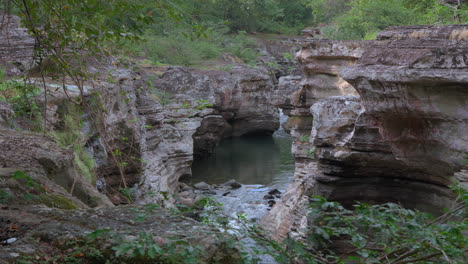 Rugged-beauty-of-Cajones-de-Chame-in-Panama,-lush-foliage-with-serene-water-flowing-through-rock-formations