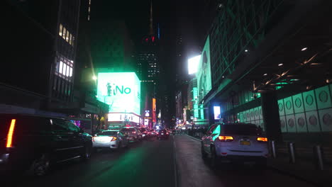 Driving-toward-the-Times-square-in-Manhattan,-nighttime-in-New-York-city,-USA