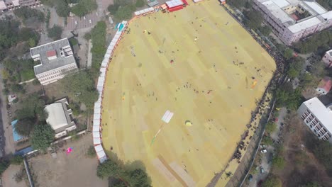 Rajkot-kite-festival-aerial-drone-view-where-many-people-from-different-countries-are-flying-their-kites-in-the-field