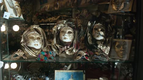 Regal-Venetian-masks-display,-Ca-'Macana,-Venice-Italy