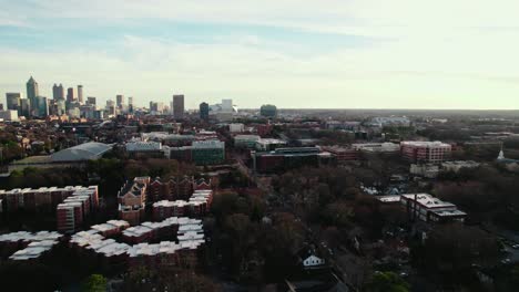 Northern-outskirts-of-Atlanta,-Georgia,-USA,-with-residential-structures-dotting-the-landscape,-the-city's-skyline-graces-the-horizon