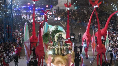 King-Balthazar-and-parade-floats-greet-children-and-families-at-the-Three-Wise-Men-festival,-also-known-as-the-Three-Kings-Parade