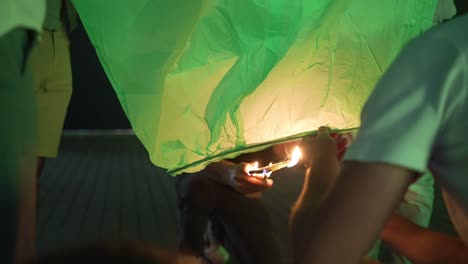 Igniting-a-lantern-for-Porto's-São-João-night