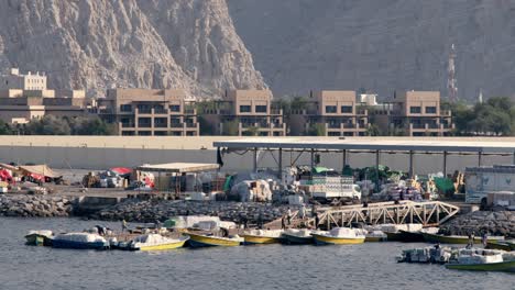 Boats-moored-at-the-end-of-the-eastern-Sea-Canal-with-Khasab-town-behind