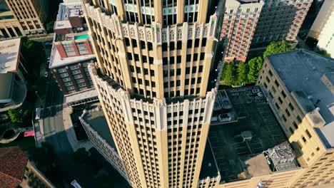 Camera-Tilt-up-while-ascending-Tower-Life-Building,-San-Antonio,-Texas,-USA