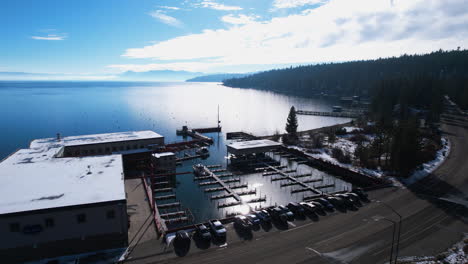 Carnelian-Bay,-Lake-Tahoe-California-USA,-Aerial-View-of-Marina-and-Coastal-Road-on-Sunny-WInter-Day