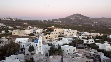 Fly-over-Megalochori-Traditional-Village-at-Blue-Hour,-Santorini,-Greece