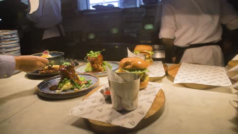 A-close-up-shot-of-gourmet-burgers-and-Irish-pork-belly-dishes-being-prepared-in-a-restaurant-kitchen-at-the-Guinness-Storehouse-in-Dublin,-Ireland