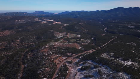 Front-Range-Colorado-cinematic-aerial-drone-Eldora-Boulder-Flat-Irons-Nederland-Indian-Peaks-winter-blue-sky-Rocky-Mountains-forest-Central-city-Black-Hawk-pine-highway-road-pan-up-forward-motion