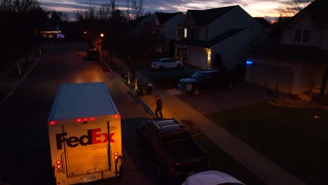 FedEx-Ground-truck-stopped-at-American-home-at-night