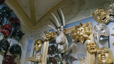 Mythical-horned-mask-amid-Venetian-splendor,-Ca'-Macana-Venice-Italy