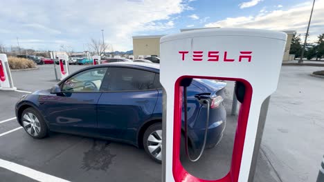Tesla-supercharger-plugged-into-a-Tesla-Model-Y