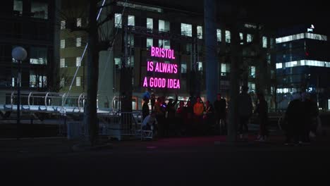 Bristol-Light-Festival-2024-Group-Have-Photo-Taken-Beneath-Installation-4K