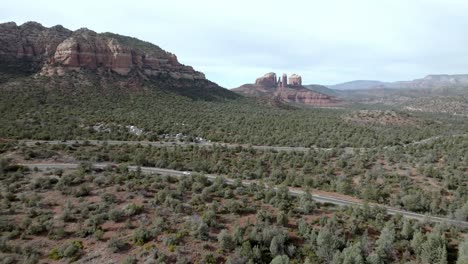 Red-rock-mountains-and-buttes-in-Sedona,-Arizona-with-drone-video-moving-in-wide-shot