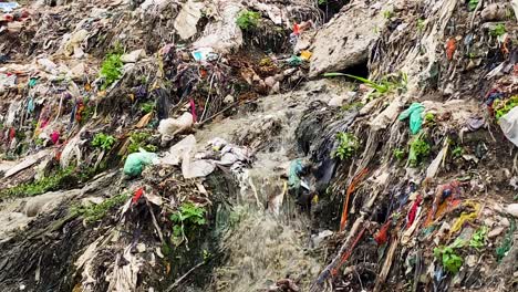 Sewage-drain-with-scattered-waste-and-debris,-environmental-pollution-issue