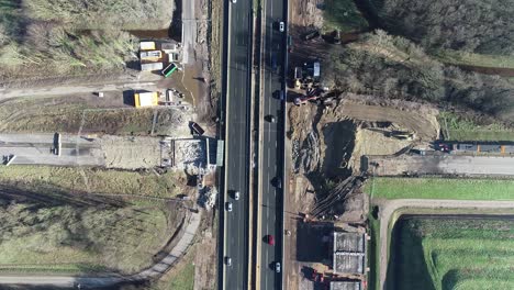 Bird's-eye-drone-shot-from-a-highway-where-cars-and-trucks-are-driving