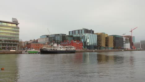 Wide-angle-view-of-Dublin-Docklands-"Silicon-Docks"-with-Liffey-river-waterfront-under-a-cloudy-sky-in-Dublin,-Ireland