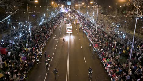 Float-riders-at-the-Three-Wise-Men-festival,-also-known-as-the-Three-Kings-Parade,-join-families-and-spectators