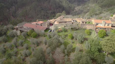 Aerial-trucking-shot-of-the-Schist-Village-Casal-de-São-Simão---a-unique-architectural-heritage-landscape-hidden-in-Central-Portugal-mountains