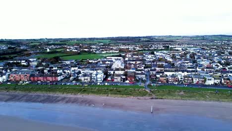 An-establishing-truck-pan-following-the-residential-coastline-of-Skerries-Beach-and-surrounding-area,-Dublin,-Ireland