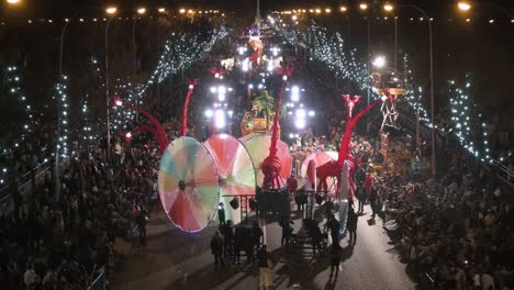 Parade-floats-greet-children-and-families-at-the-Three-Wise-Men-festival,-also-known-as-the-Three-Kings-Parade