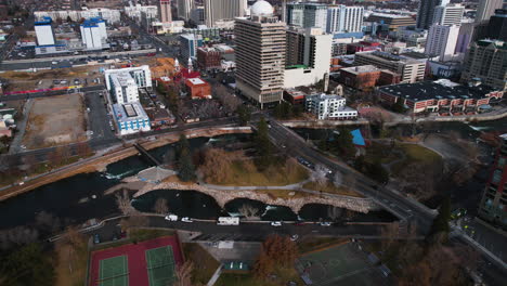 Downtown-Reno-Nevada-USA,-Aerial-View-of-Buildings,-Wingfield-Park-and-Truckee-River