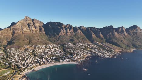 Drone-view-of-the-Twelve-Apostles-mountains-overlooking-the-bay-of-Cape-Town-and-Camps-Bay,-South-Africa