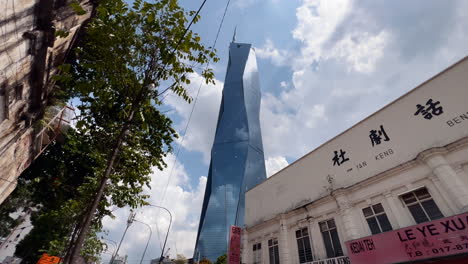 Low-Angle-View-Of-Warisan-Merdeka-Tower-In-Downtown-Kuala-Lumpur-Malaysia,-Dolly-View