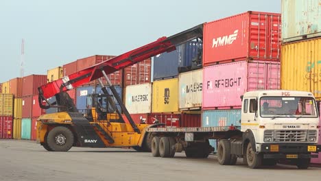 A-container-crane-truck-moving-containers-on-a-dock-yard-or-dry-port-at-a-port-in-India