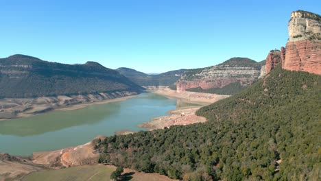 Sau-swamp-dike-in-Catalonia,-Spain,-intense-drought-in-2024-Famous-Sau-Dam-with-very-little-water