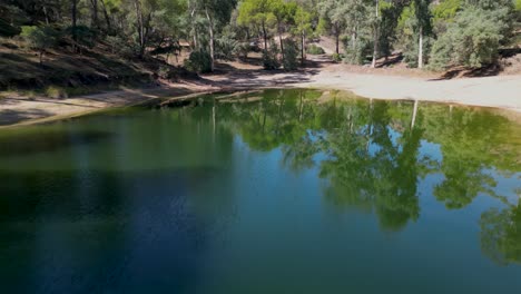 Aerial-reveals-magnificent-views-of-Sierra-de-Andujar-lake-beauty-spot-and-forest-mountain-landscape