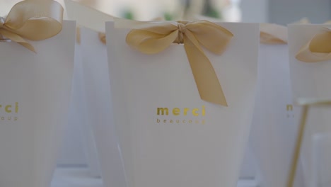 Merci-Favor-Bags-with-Elegant-Gold-Ribbons