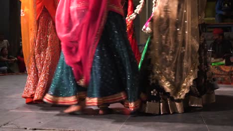 Colorful-dresses-of-traditional-Indian-dancers,-low-angle-view