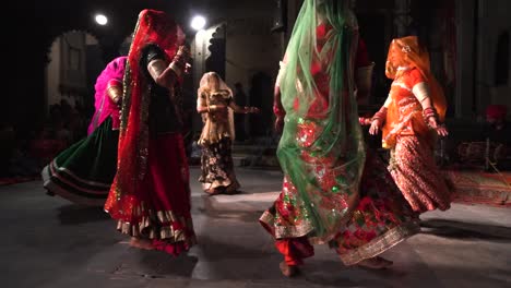 Women-in-traditional-Indian-dresses-dances-in-festival